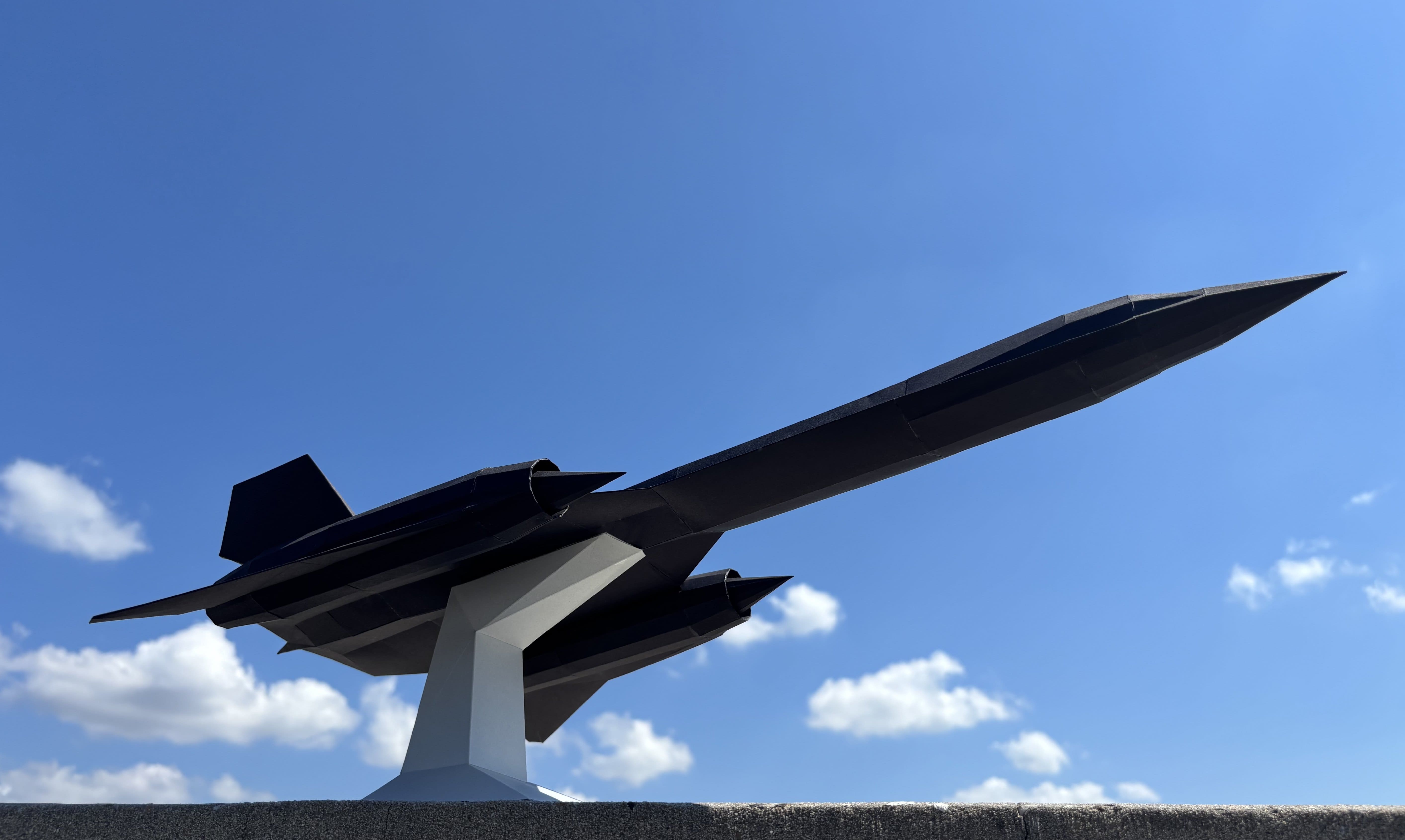 Side view of finished paper model, on its stand